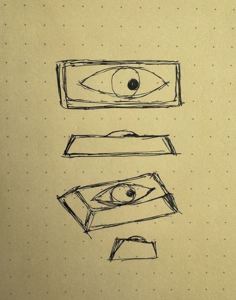 Pen sketch on yellow dot-grid paper of an Enter keycap with a single eye: a top view, a front view, a three-quarter view and a side view