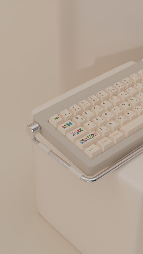 The keyboard tilted on the edge of a white cube, its colourful shape novelties catching the light