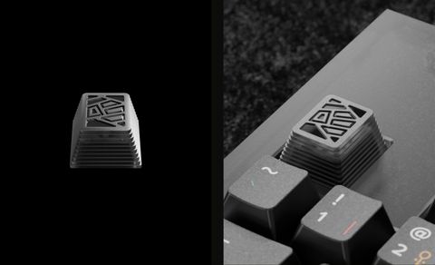 Grayscale artisan keycap with an angular Tribal-pattern sculpt, shown alone and mounted on a keyboard